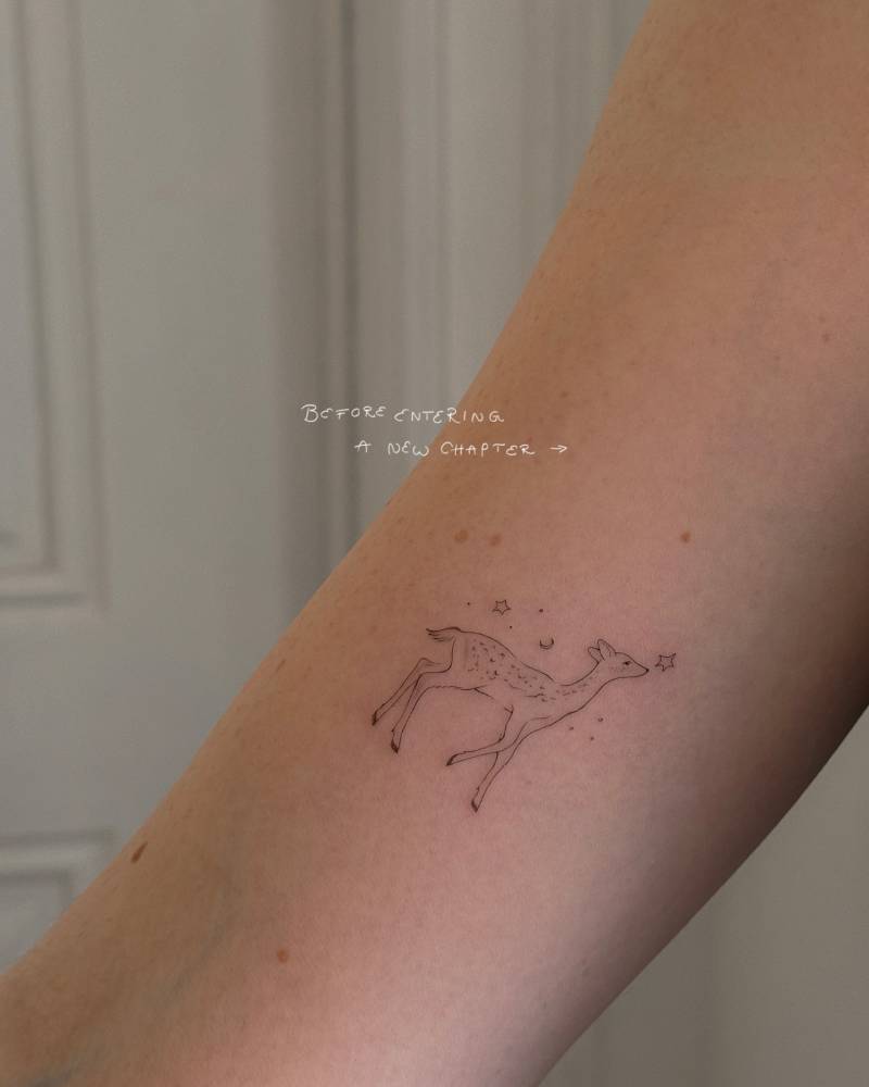 Fawn tattoo in fine line style located on the inner arm.