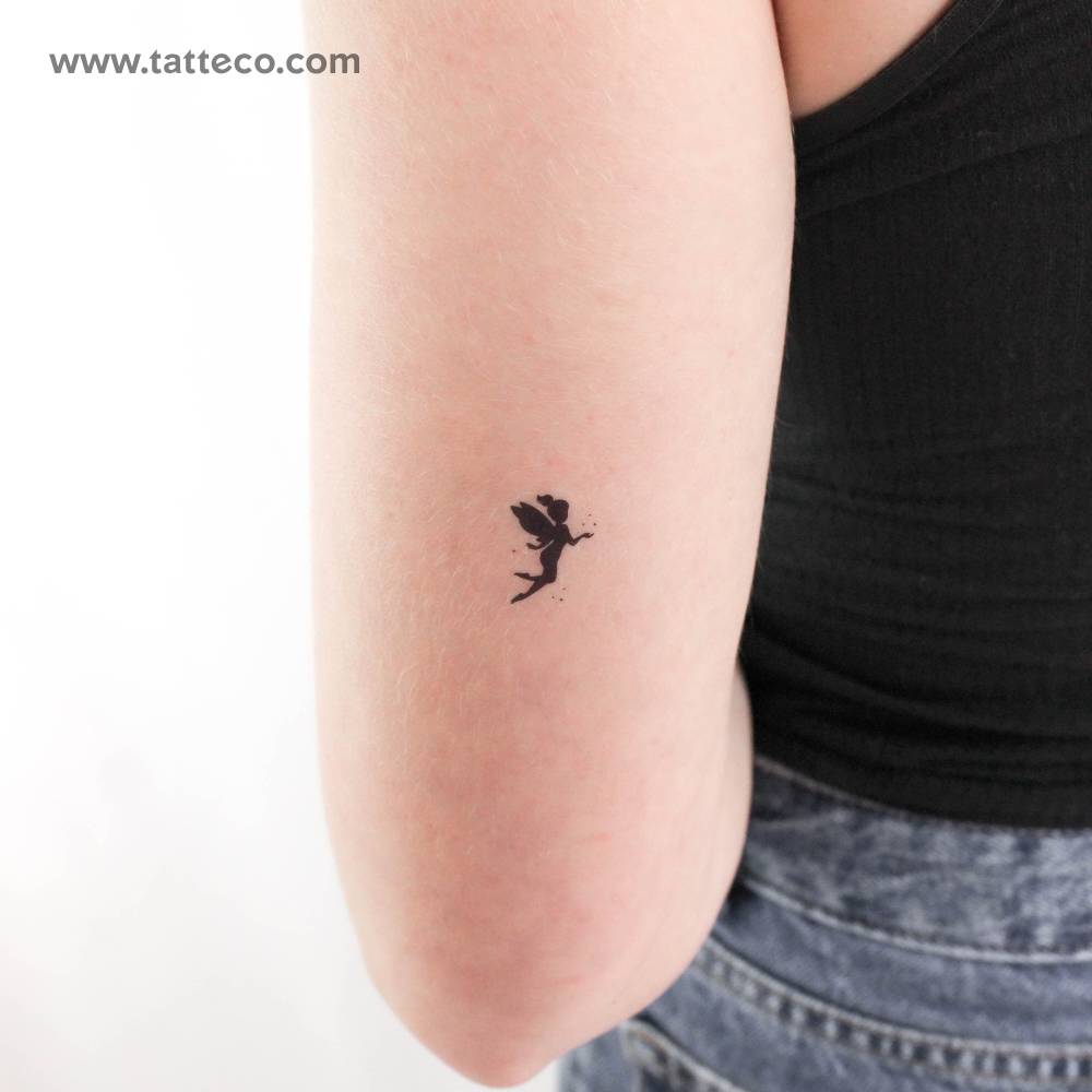 Fairy silhouette temporary tattoo located on the tricep.