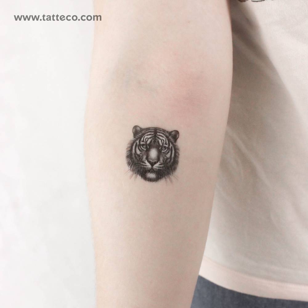 Tiger head temporary tattoo located on the inner forearm.