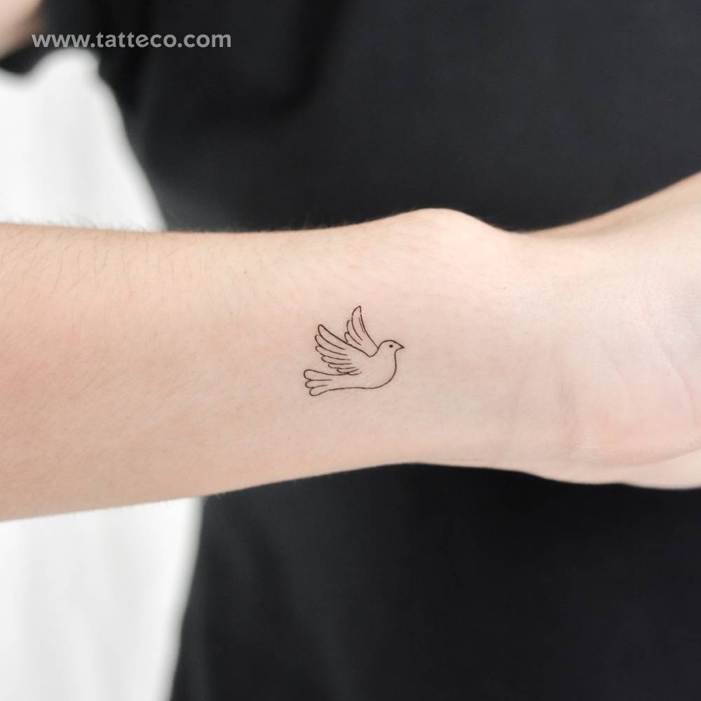 Little minimalistic dove temporary tattoo located on the wrist.