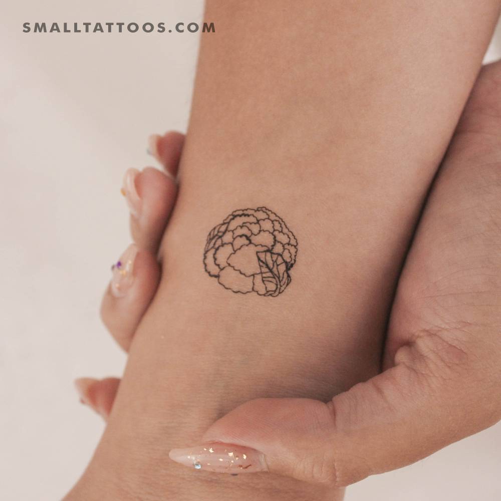 Fine line style cauliflower temporary tattoo located on the wrist.