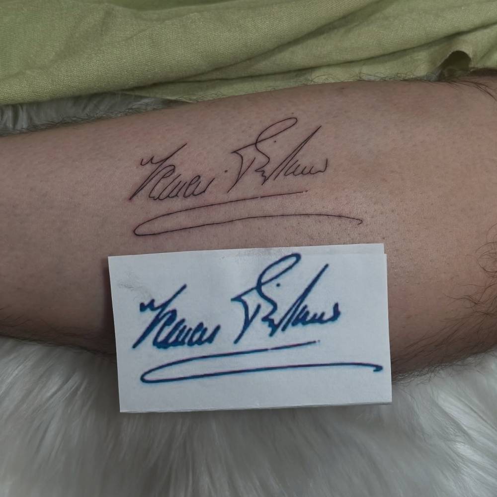 Signature tattoo located on the shin.