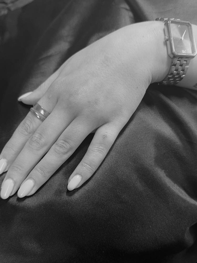 Micro ornament tattooed on the finger, done in minimalistic style.