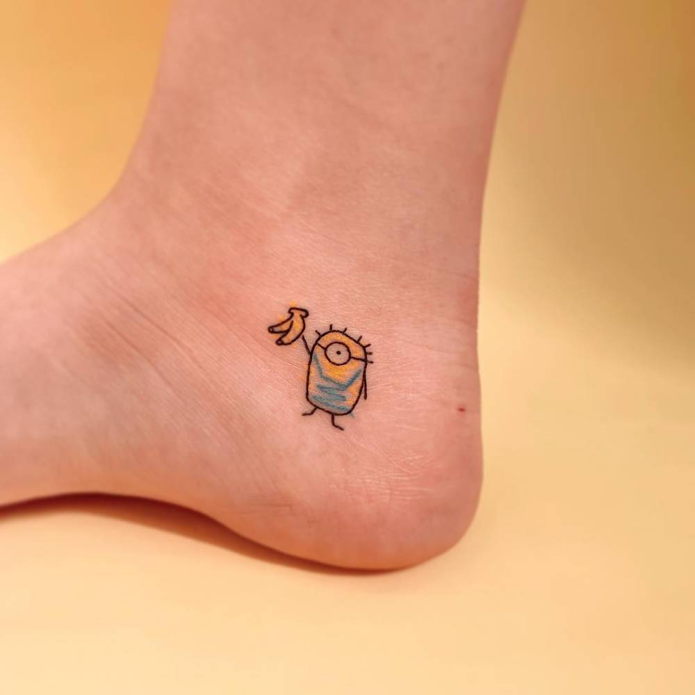 Ignorant style Minion tattoo done on the ankle.