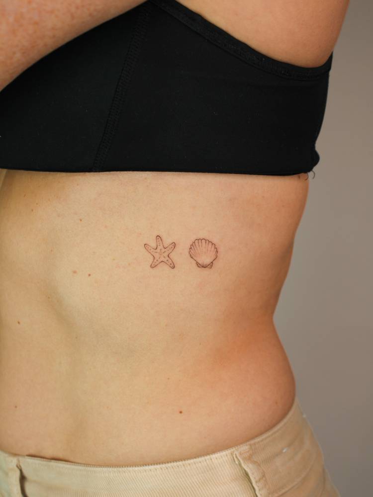Starfish and scallop shell tattoo in fine line style.