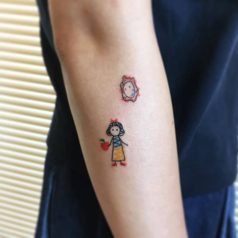 Ignorant style Snow White tattoo located on the forearm.