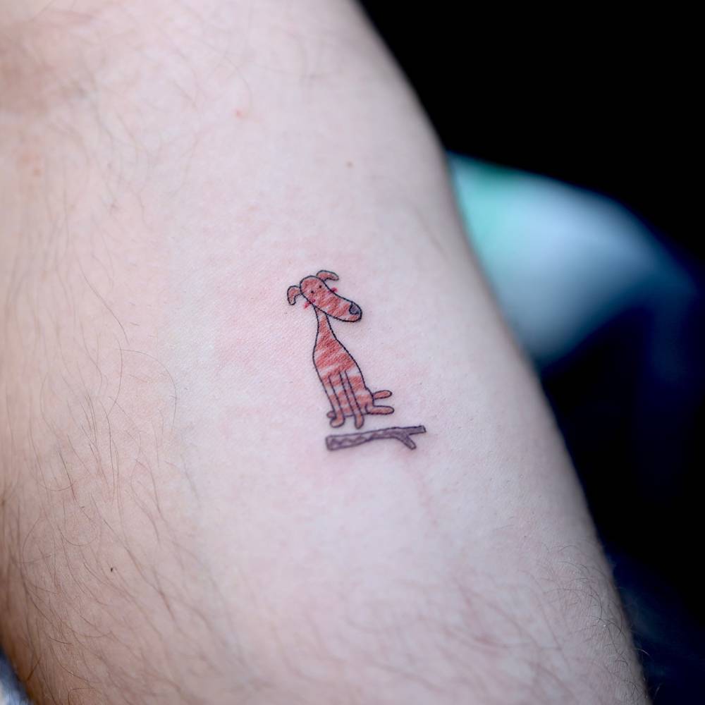 Ignorant style greyhound tattoo located on the inner forearm.