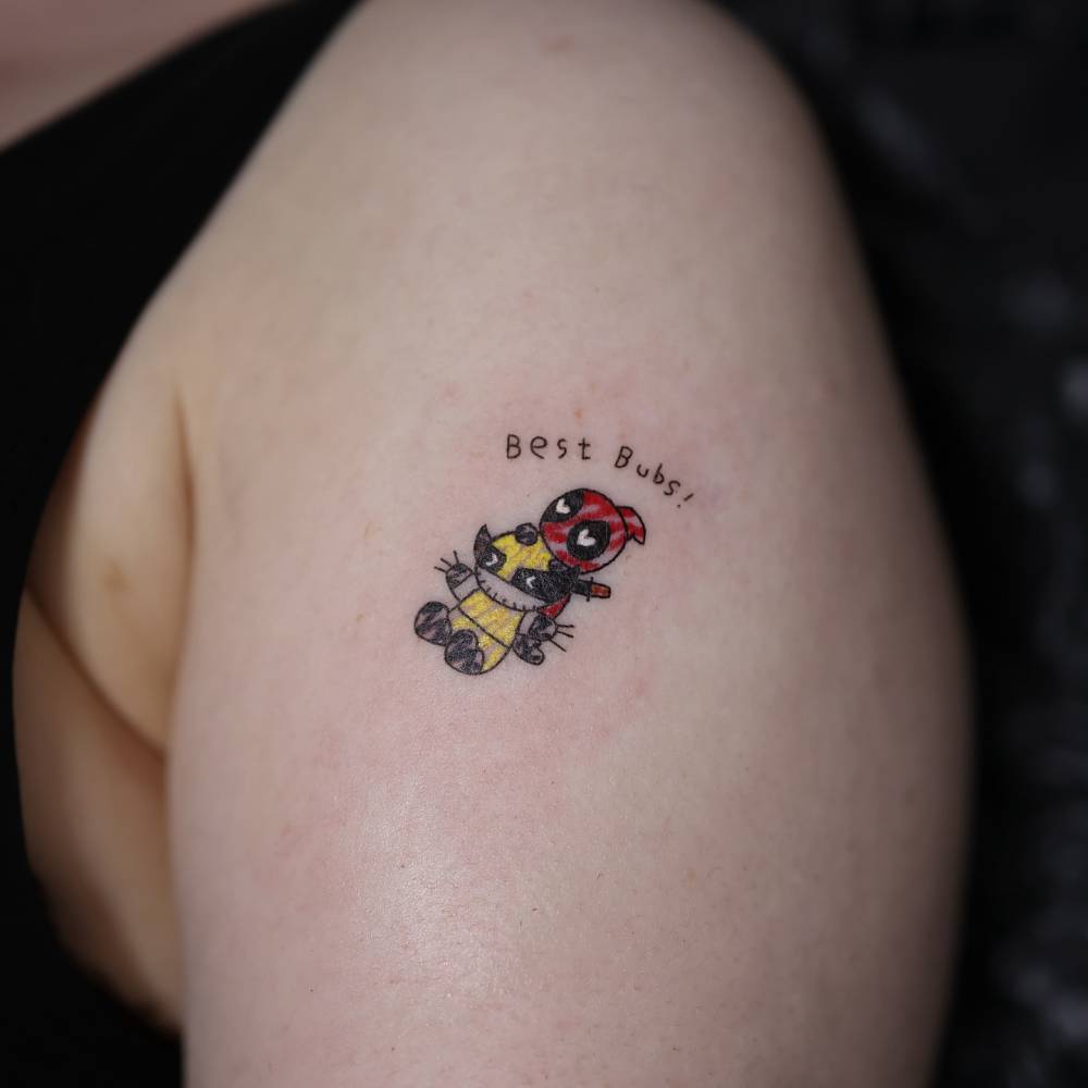 Ignorant style Deadpool and Wolverine tattoo located on the upper arm.