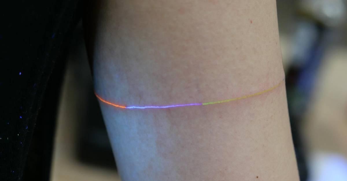 Spectrogram Tattoo Spectrum armband tattoo in UV ink located on the upper