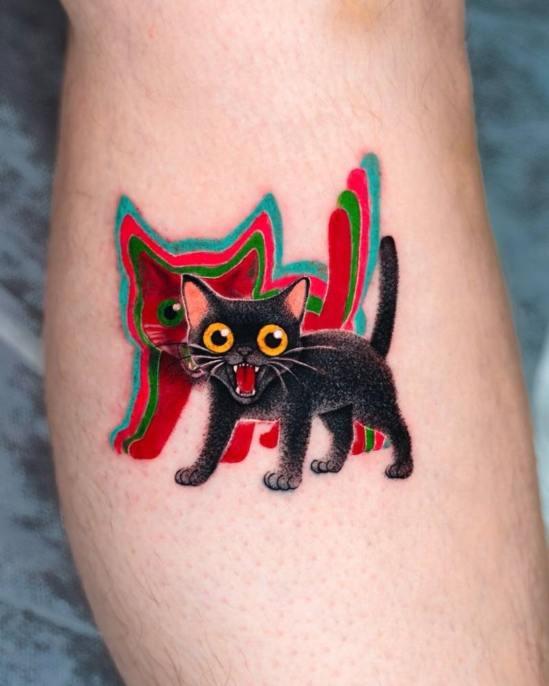 Psychedelic black cat tattoo located on the calf.