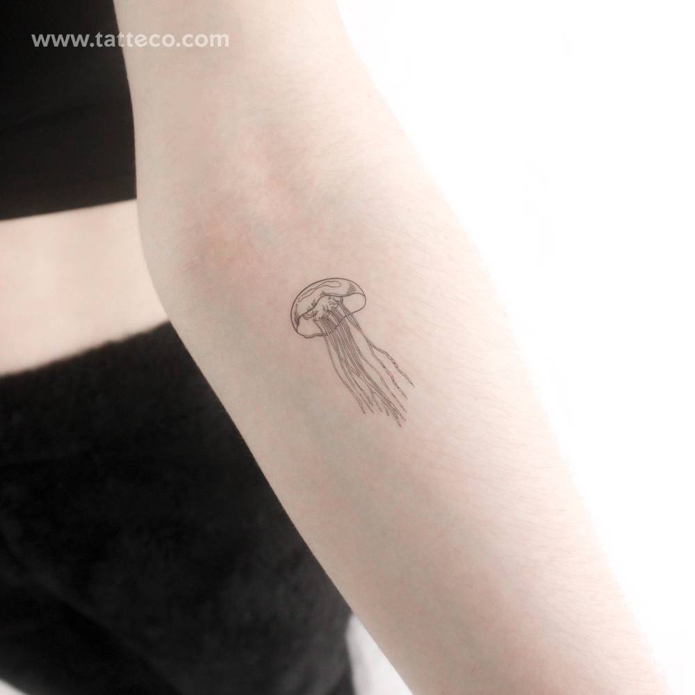 Fine line style jellyfish temporary tattoo located on the inner forearm.