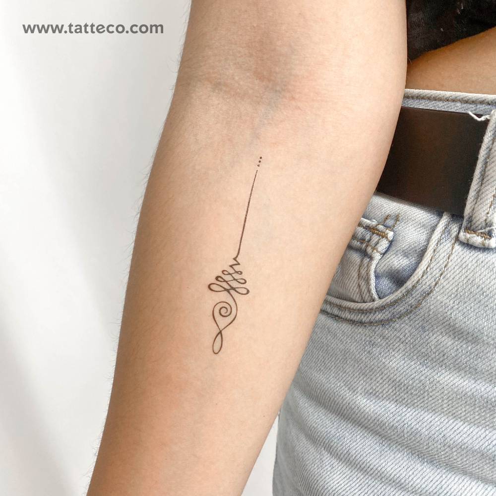 Fine line style Unalome temporary tattoo located on the inner forearm.