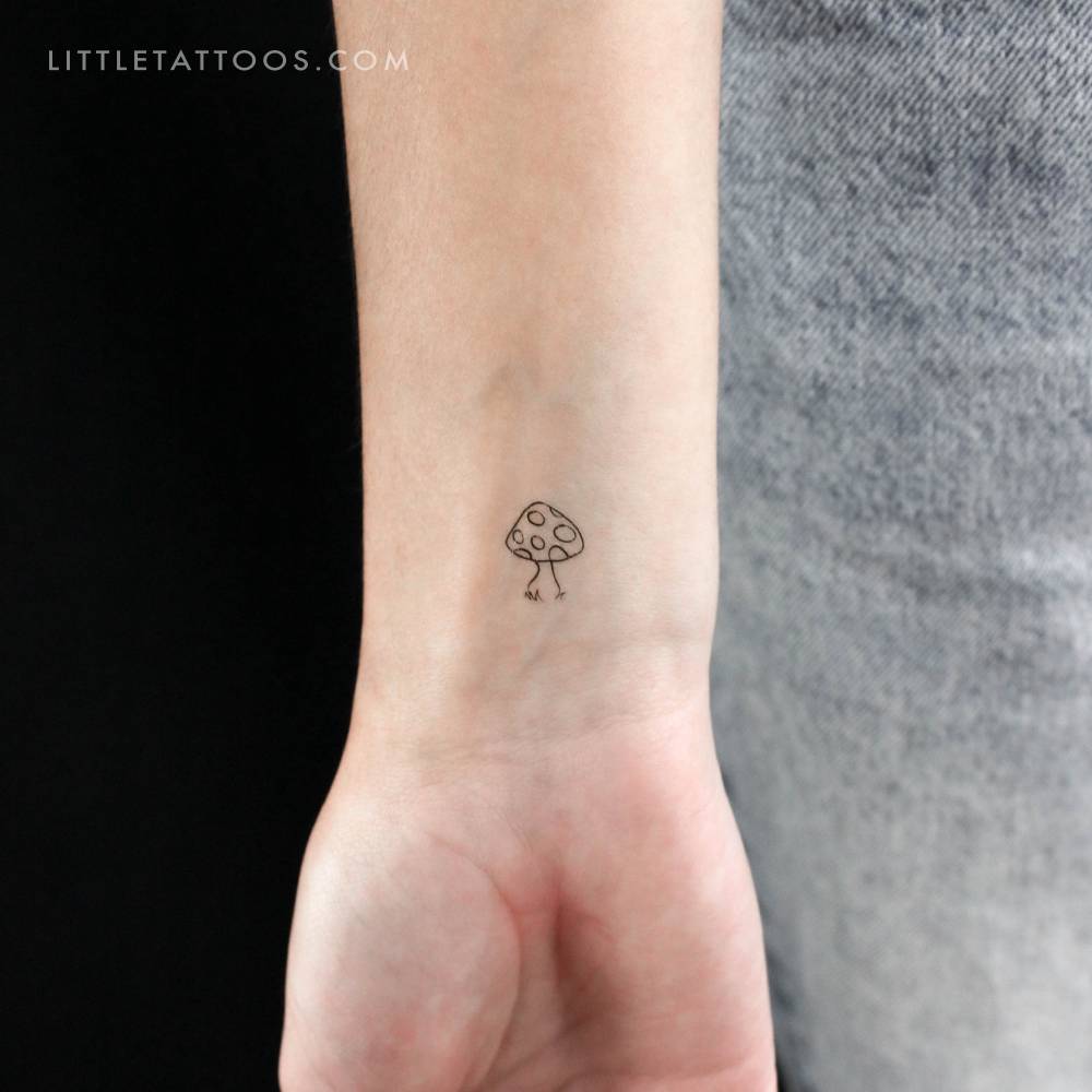 Mushroom temporary tattoo located on the wrist.
