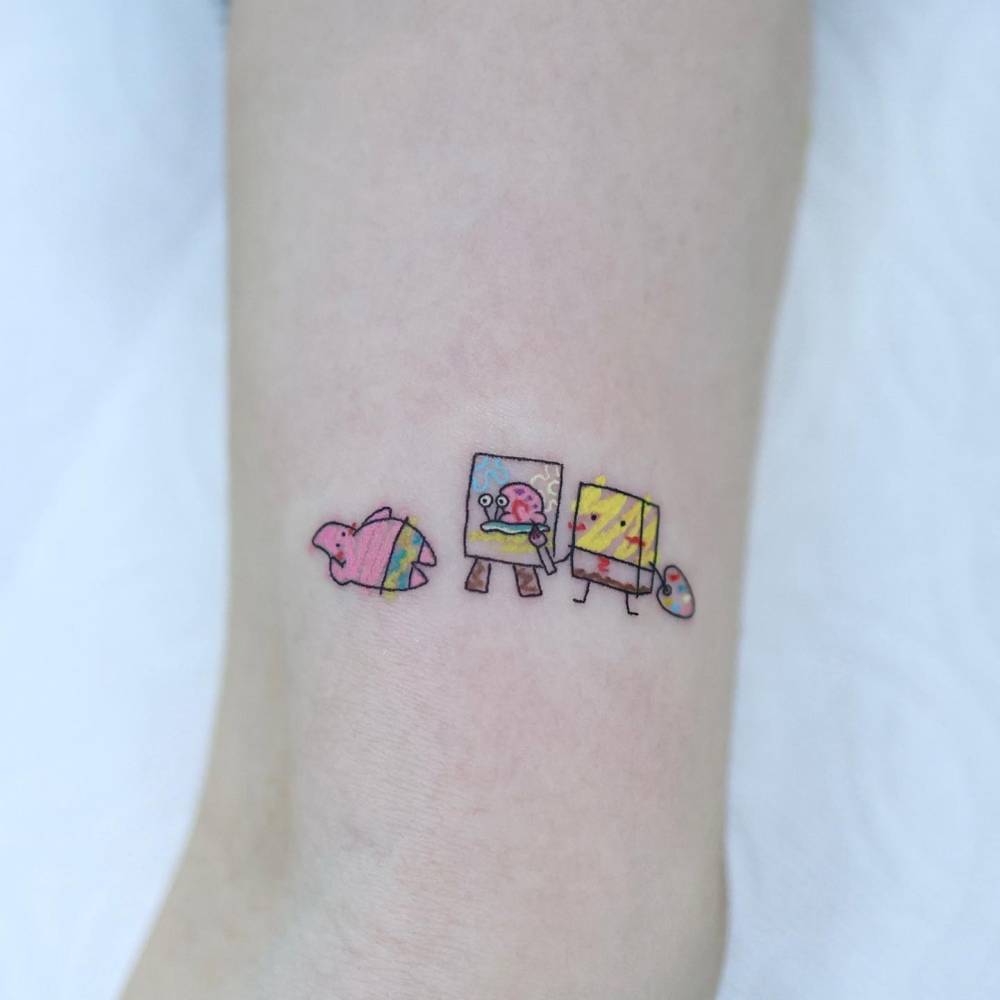 Spongebob Squarepants and Patrick Star tattoo located on the inner arm.