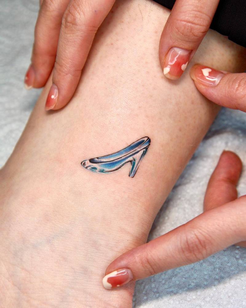 Cinderella's glass shoe tattooed on the ankle.