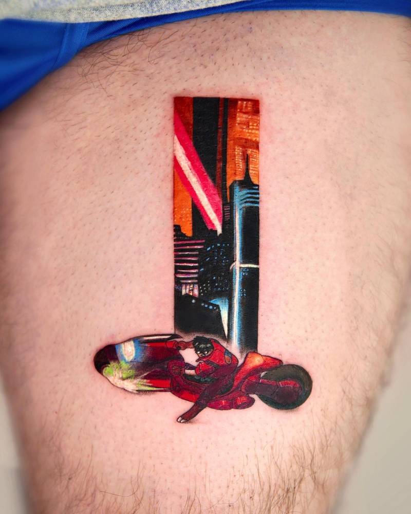 Akira tattoo in cartoon style located on the thigh.