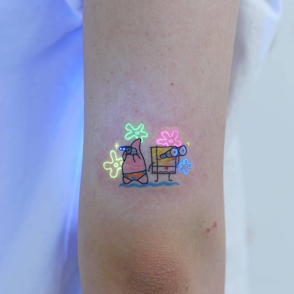 Cartoon style Spongebob and Patrick Star tattoo located on the tricep.