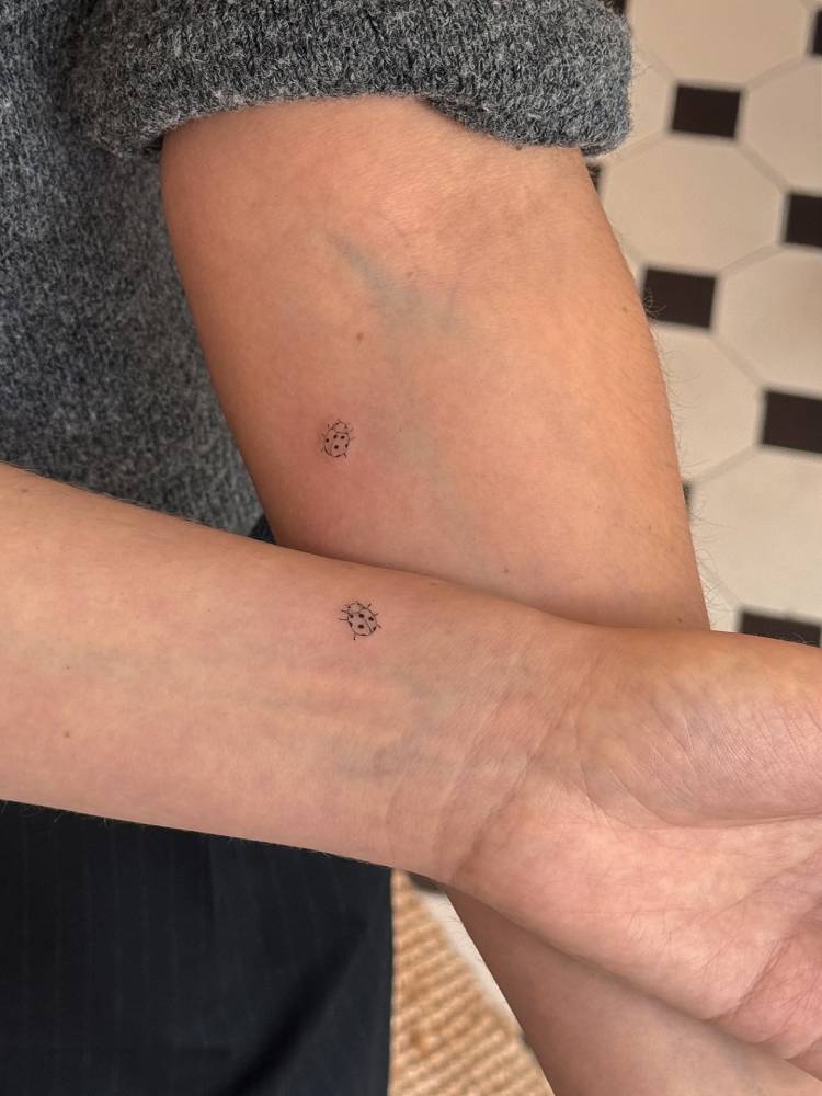Matching minimalistic ladybug tattoo for best friends.
