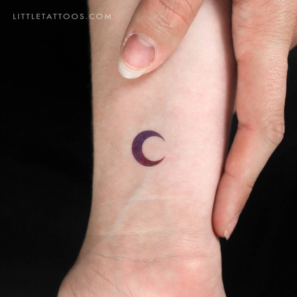 Purple and pink crescent moon temporary tattoo.