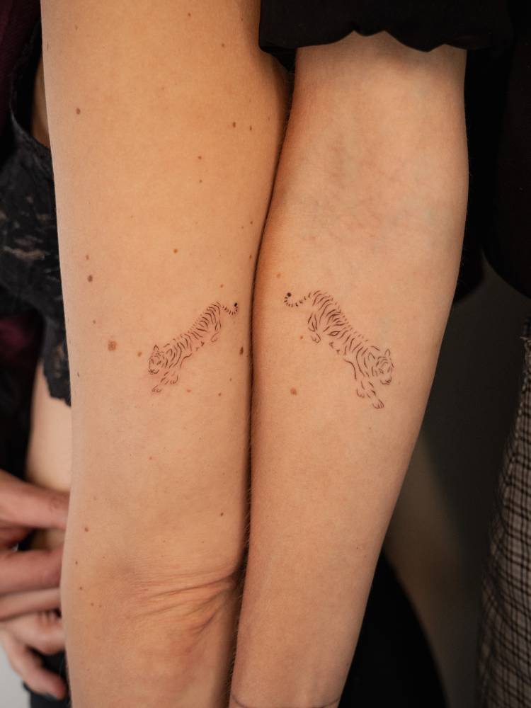 Matching fine line tiger tattoo for best friends.