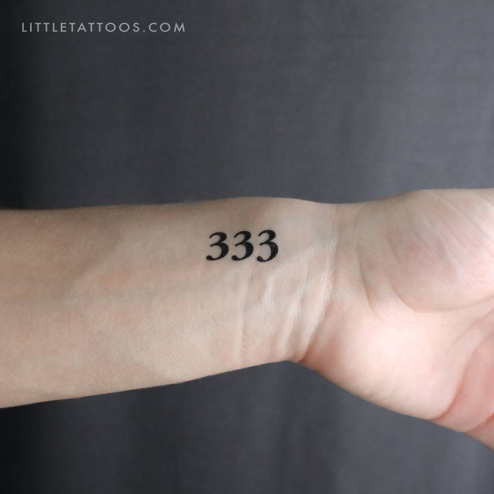 333 angel number temporary tattoo located on the wrist.