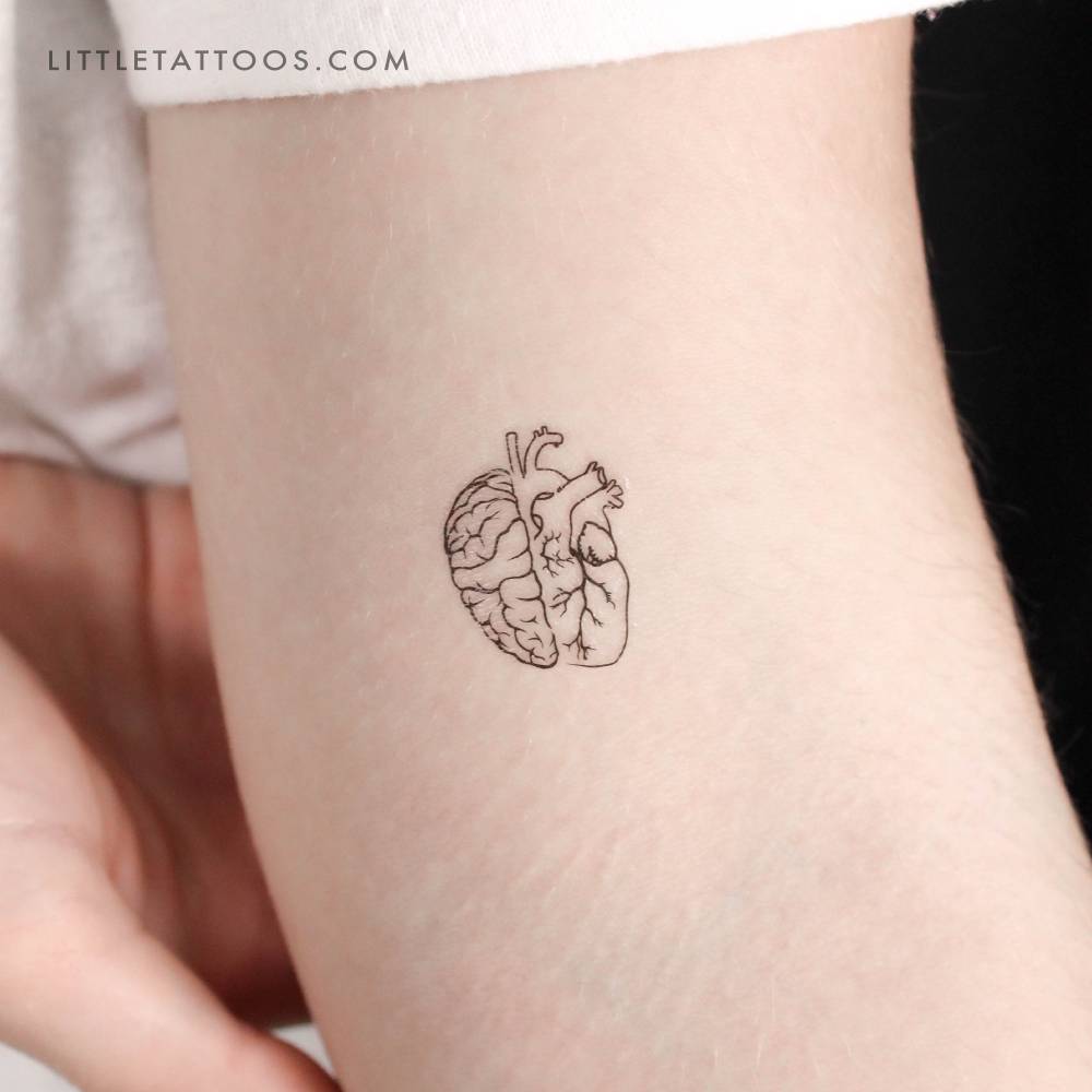 Half heart half brain temporary tattoo placed on the inner arm.