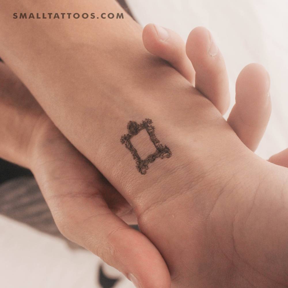 Frame temporary tattoo located on the wrist.