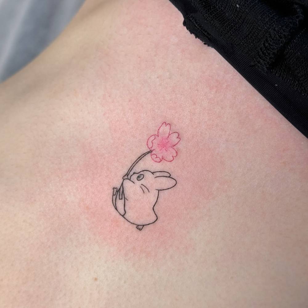Fine line style Chuu Totoro tattoo located on the rib.