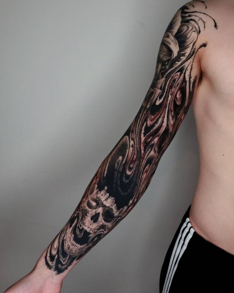 Abstract style skull and flow tattoo sleeve.