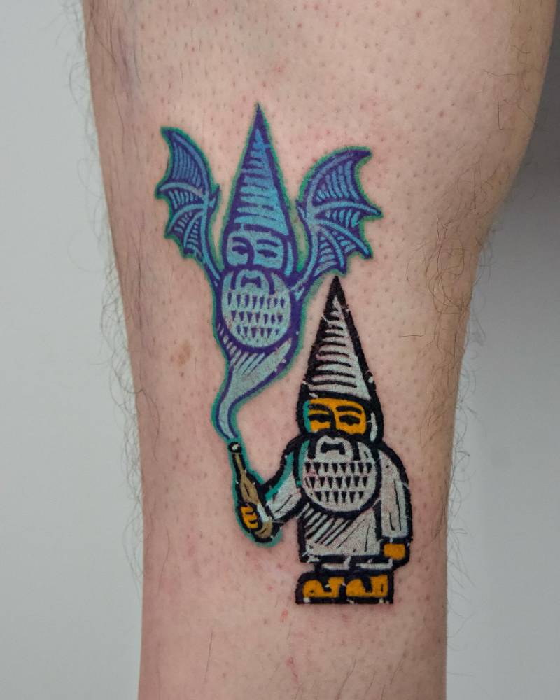 Gnome tattoo in pop art style located on the shin.