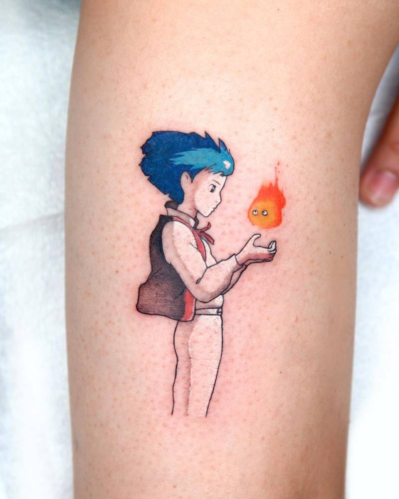 Young Howl and Calcifer tattoo located on the upper arm.