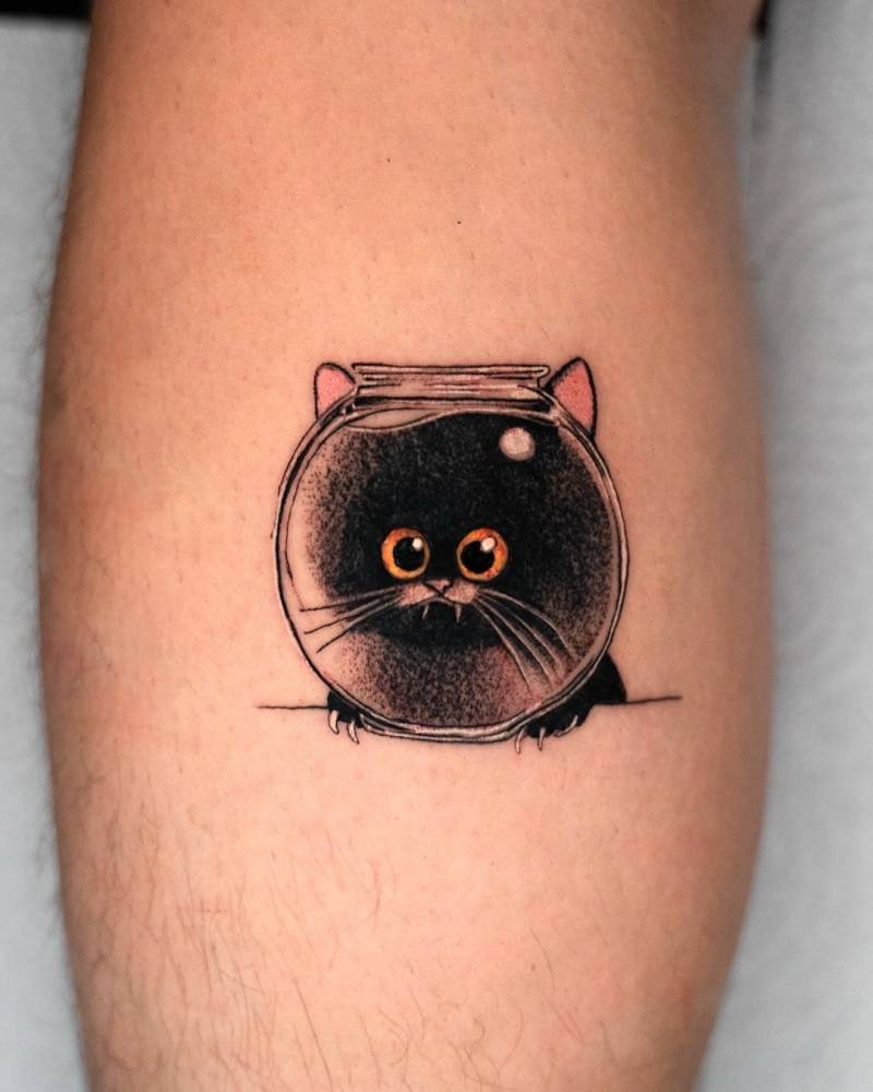 Black cat and fish bowl tattoo located on the calf.