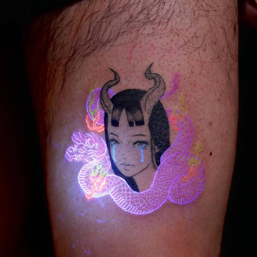 She-devil tattoo in comic style located on the thigh.
