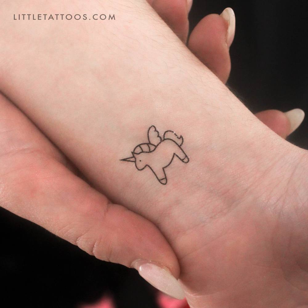 Minimalist little unicorn temporary tattoo located on the wrist.