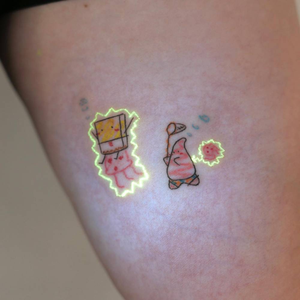 Spongebob and Patrick Star tattoo located on the inner arm.
