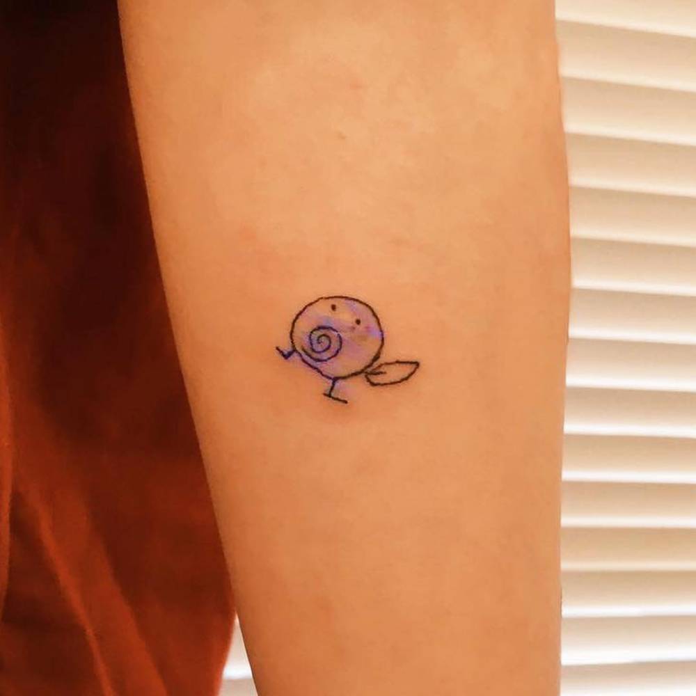 Poliwag tattoo in cartoon style placed on the inner forearm.