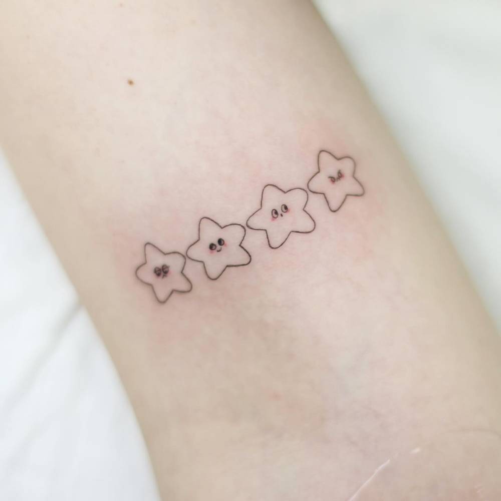 Cute little stars tattooed on the inner arm.