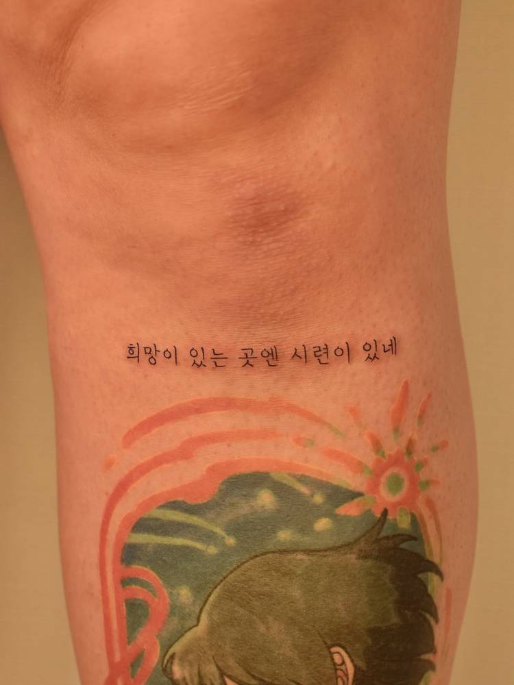 Korean lettering tattoo located on the shin.
