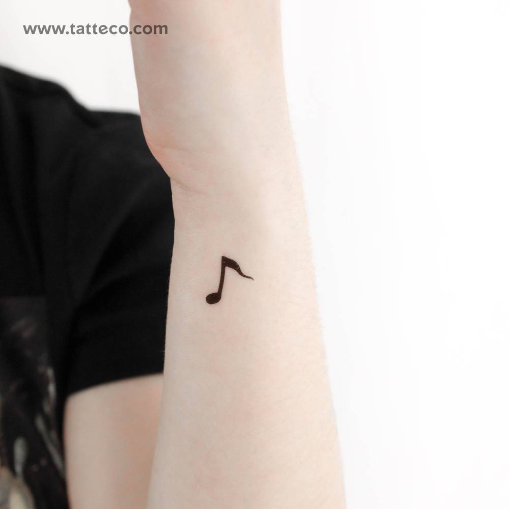 Minimalistic style quaver temporary tattoo located on the wrist.