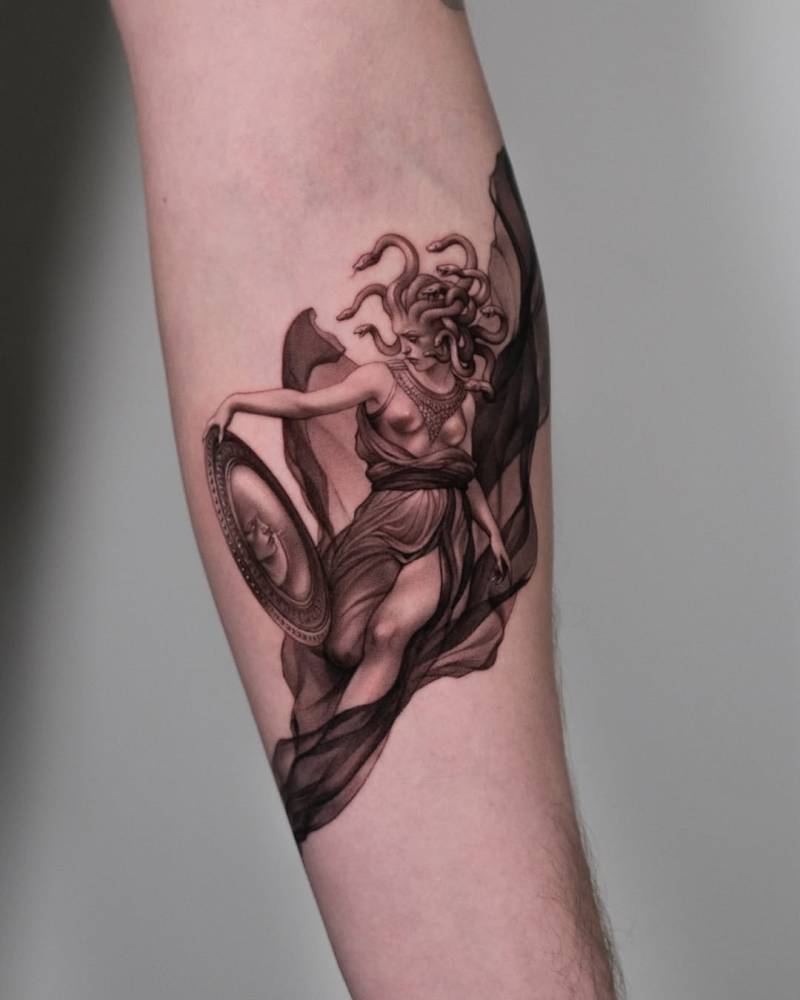 Medusa tattoo in micro-realistic style done on the inner forearm.