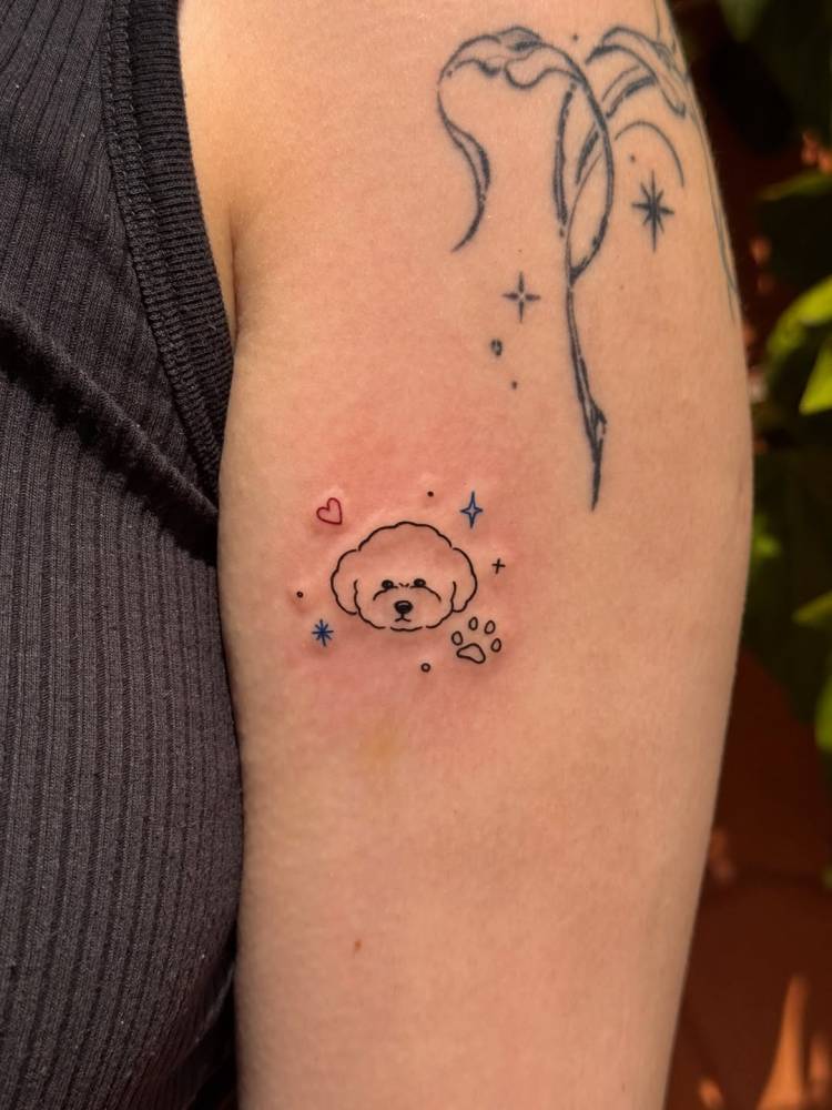 Shih Tzu portrait tattoo in minimalistic style located on the upper arm.