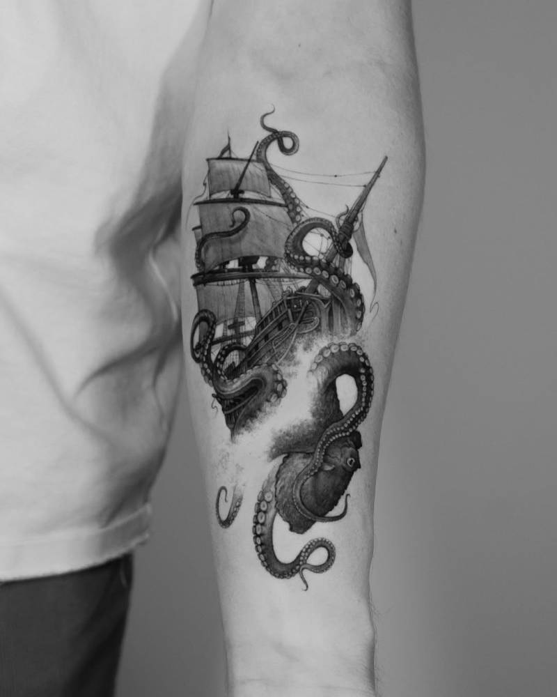 Kraken and sailing ship tattoo located on the inner forearm.