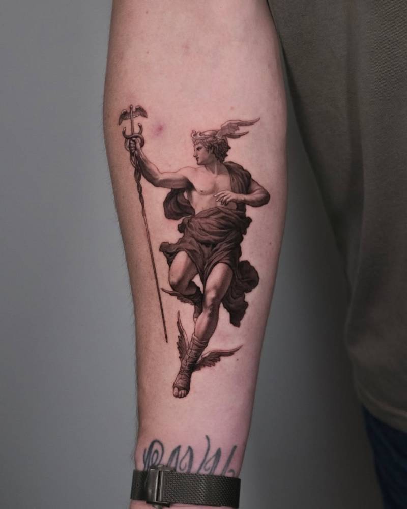 Hermes tattoo in micro-realistic style placed on the inner forearm.