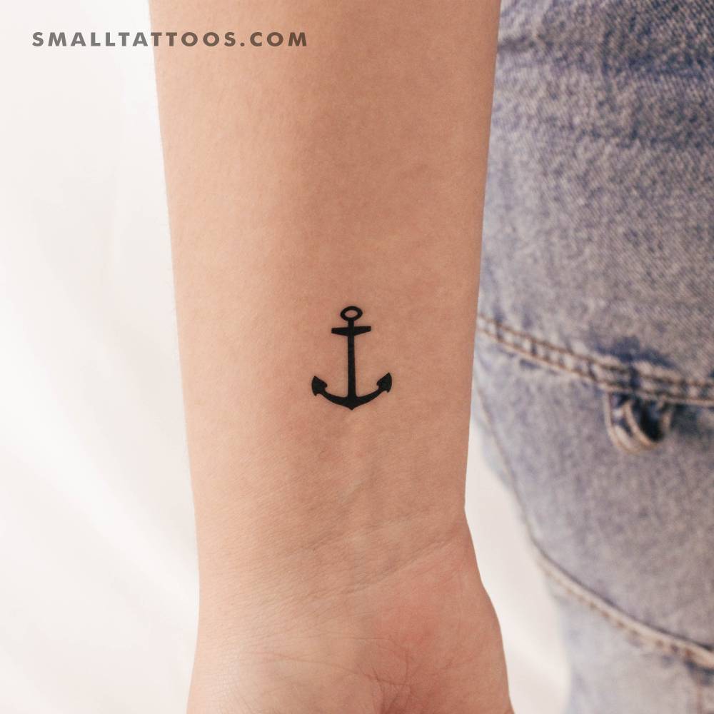 Minimalistic small anchor temporary tattoo located on the wrist.
