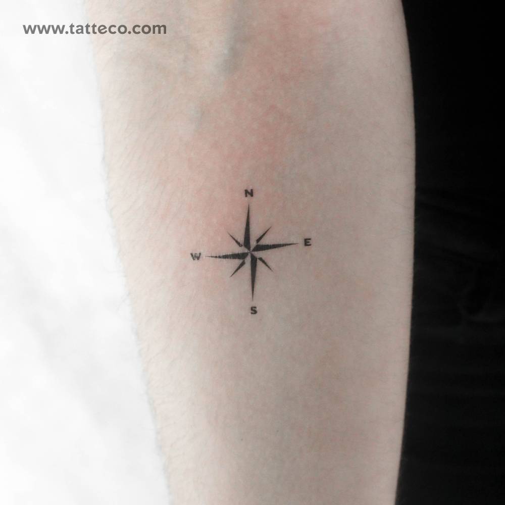 Compass rose temporary tattoo placed on the inner forearm.