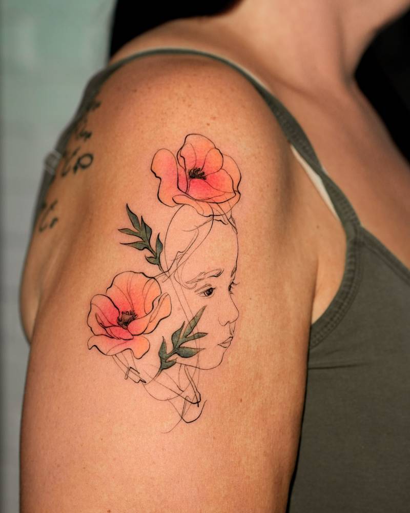 Granddaughter’s face and poppy flowers.
