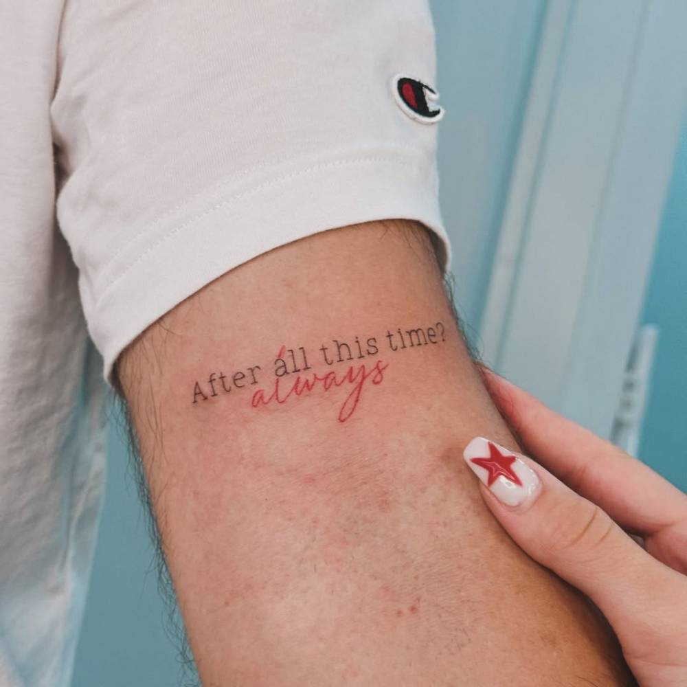 "After all this time? Always" lettering tattoo placed on the bicep.