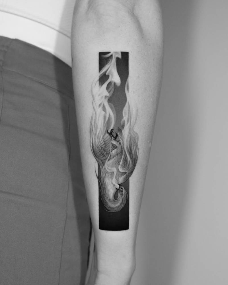 Phoenix tattoo located on the forearm, done in micro-realism.