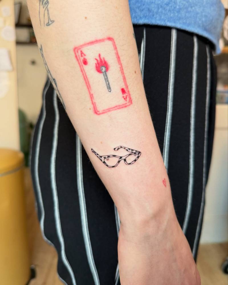 Illustrative style eyeglasses tattoo located on the wrist.