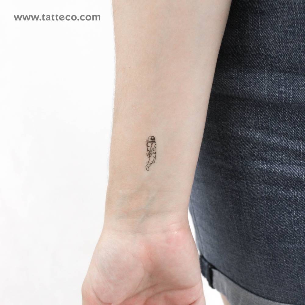 Small astronaut temporary tattoo placed on the wrist.